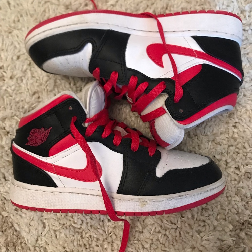 Nike Air Jordan 1 Mid Sneakers.
